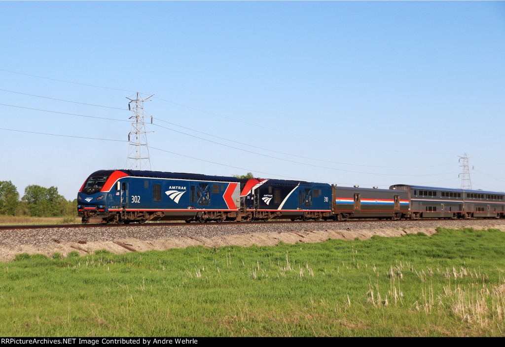 Dual ALC-42s "Charge" into the bright light of a perfect spring evening, just out of No. 7's station stop